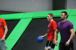 Three Men Playing Trampoline Dodgeball